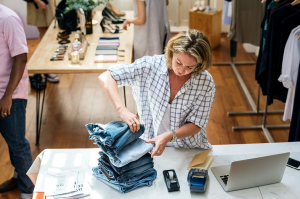woman stacking jeans